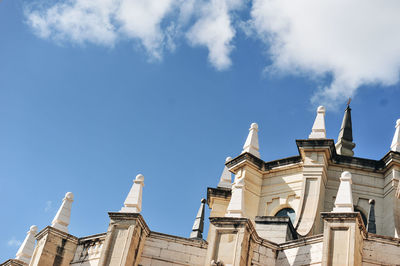 Low angle view of building against blue sky