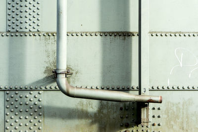 Close-up of pipes on metallic wall