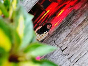 Low angle view of wood against wall