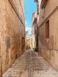 Narrow alley amidst buildings in town