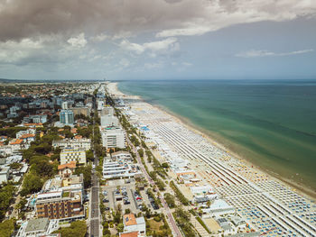 High angle view of sea and buildings against sky