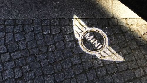 High angle view of road sign on street