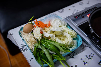 High angle view of vegetables in plate on table