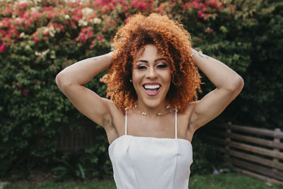 Portrait of hispanic brunette woman with afro