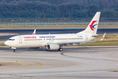 View of airplane at airport runway