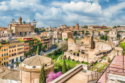 View of roman forum against cloudy sky