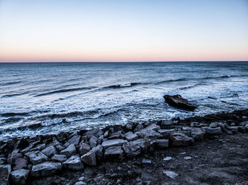 Scenic view of sea against sky during sunset