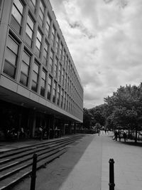 Street amidst buildings against sky