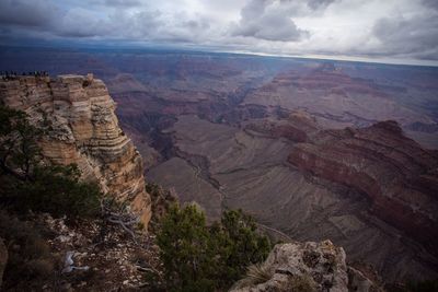 Scenic view of mountains against cloudy sky