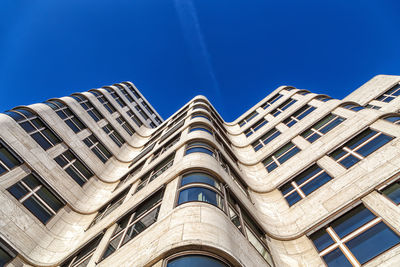 Low angle view of building against clear blue sky