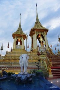 Statue of temple against building