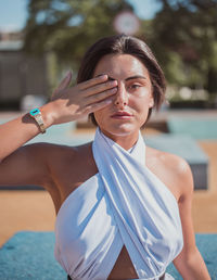 Portrait of young woman in swimming pool