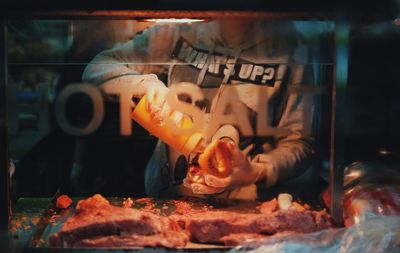 Person making food at market stall