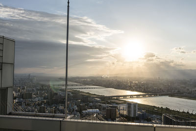 High angle view of river along cityscape