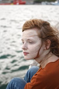 Portrait of young woman looking away