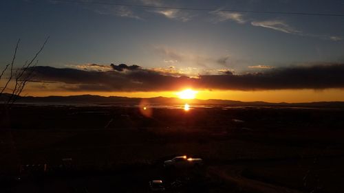 Scenic view of landscape at sunset