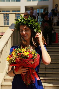 Woman holding flower bouquet