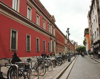 Bicycles on street amidst buildings in city