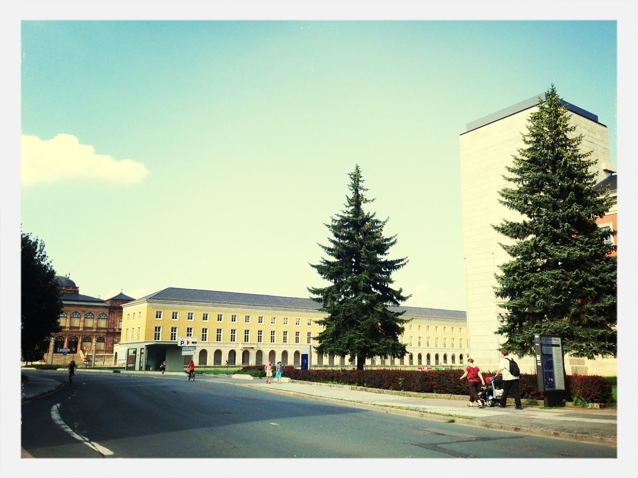 building exterior, architecture, transfer print, built structure, blue, city, clear sky, auto post production filter, street, sunlight, sky, road, tree, shadow, day, incidental people, city life, the way forward, men