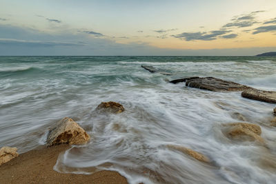 Scenic view of sea against sky during sunset