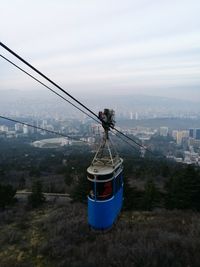 High angle view of overhead cable cars against sky