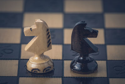 Close-up of chess pieces on table