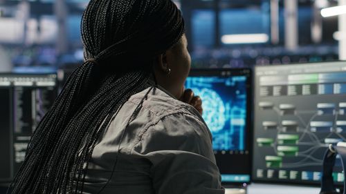 Rear view of woman looking away