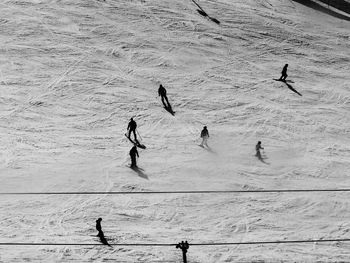 High angle view of people skiing on snow