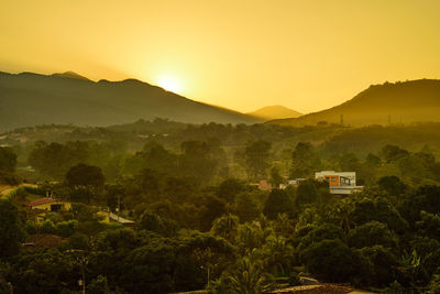 Scenic view of mountains against sky during sunset