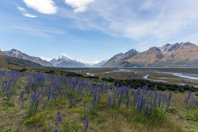 Scenic view of mountains against cloudy sky