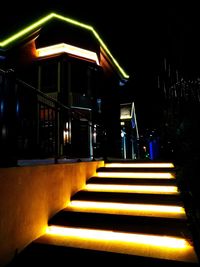 Illuminated staircase at night