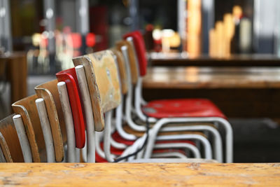 Close-up of empty chairs on table