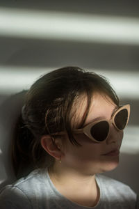 Portrait of young woman wearing sunglasses