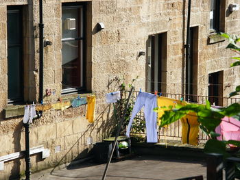 Clothes drying on balcony of building