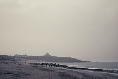 Scenic view of beach against clear sky