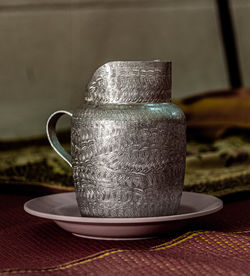 Close-up of coffee cup on table