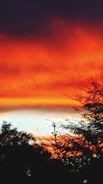 Scenic view of dramatic sky at sunset