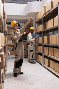 Rear view of man standing in factory