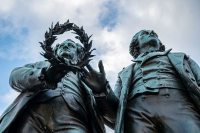 Low angle view of statue against sky