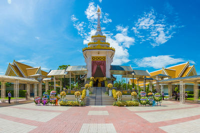 Built structure against blue sky and clouds