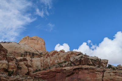 Low angle view of rock formations against sky