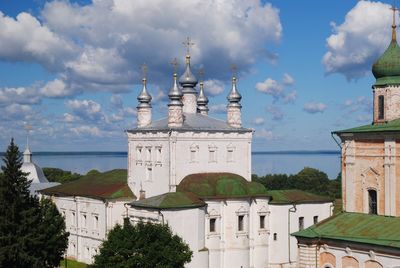 Churches against cloudy sky