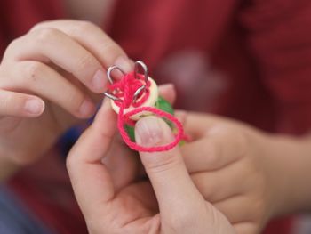 Cropped hands holding toy