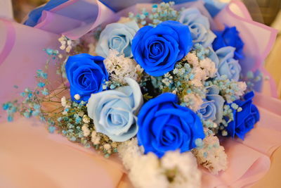 Midsection of woman holding bouquet