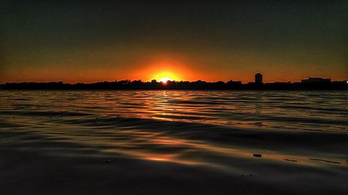 Scenic view of sunset over river