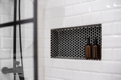 Soap and shampoo dispenser in bathroom