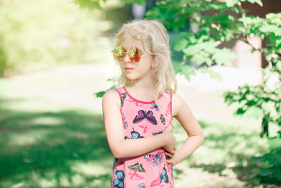 Portrait of cute girl standing outdoors