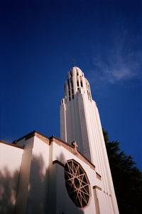 Low angle view of building against blue sky