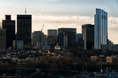Modern buildings in city against sky