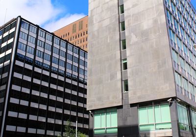 Low angle view of office building against sky